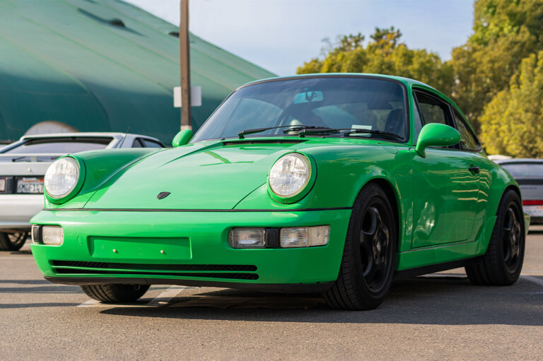 Green Porsche 964 on road