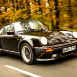 Black Porsche 930 Widowmaker 911 driving