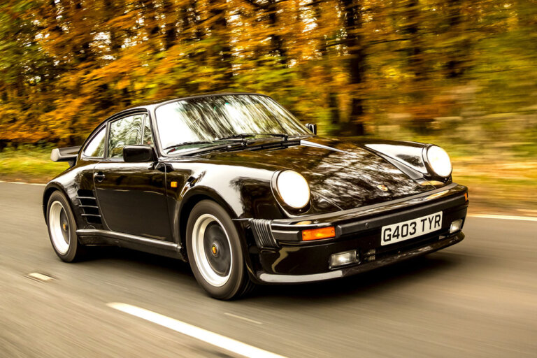 Black Porsche 930 Widowmaker 911 driving