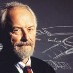 Man in profile view in front of a chalk board