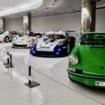 Various Porsche 911's next to one another display