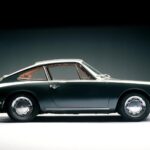 green Porsche 911 white and dark background