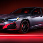Silver Acura TLX Type S PMC on dark background glowing red