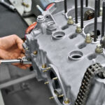 Man working on Porsche Engine block