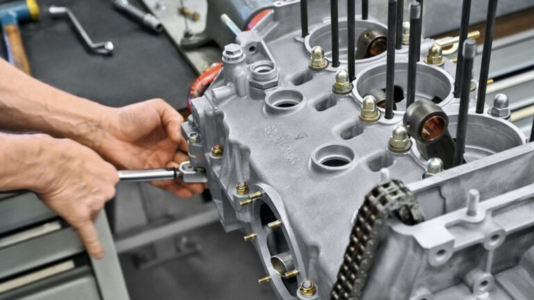 Man working on Porsche Engine block