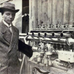black and white photo of a young Gustav Otto next to engine