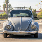 blue vw beetle in parking lot