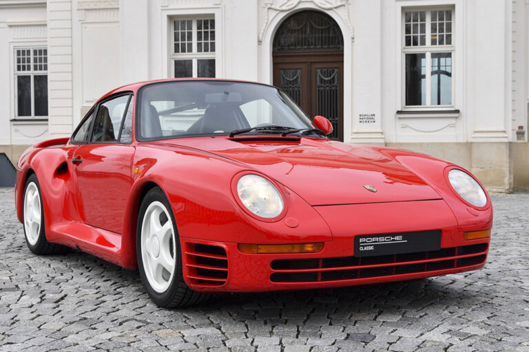 Red Porsche 959 on brick road