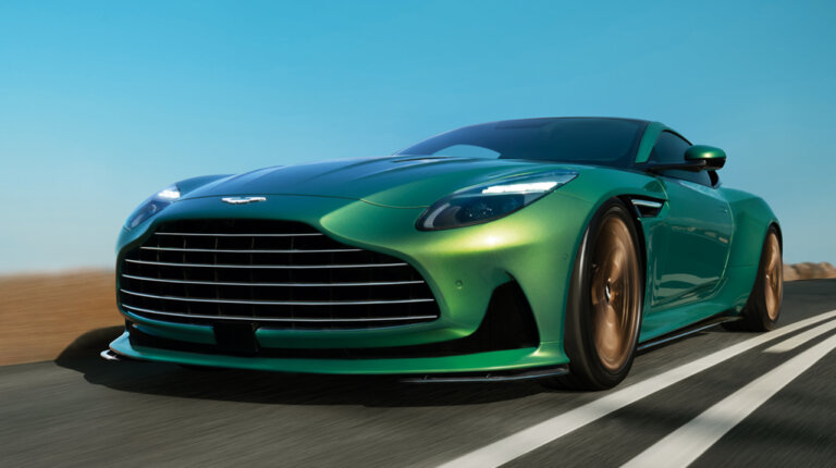 Green Aston Martin DB12 Super Car on a road during a clear blue day