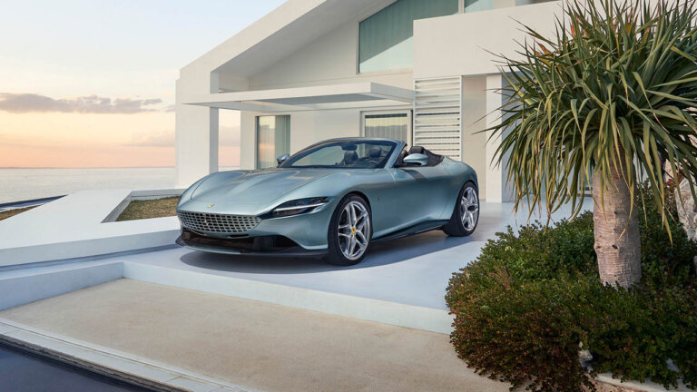 Ferrari Roma Spider sitting next to a beach house