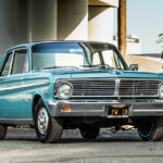 blue 75 ford falcon underneath bridge