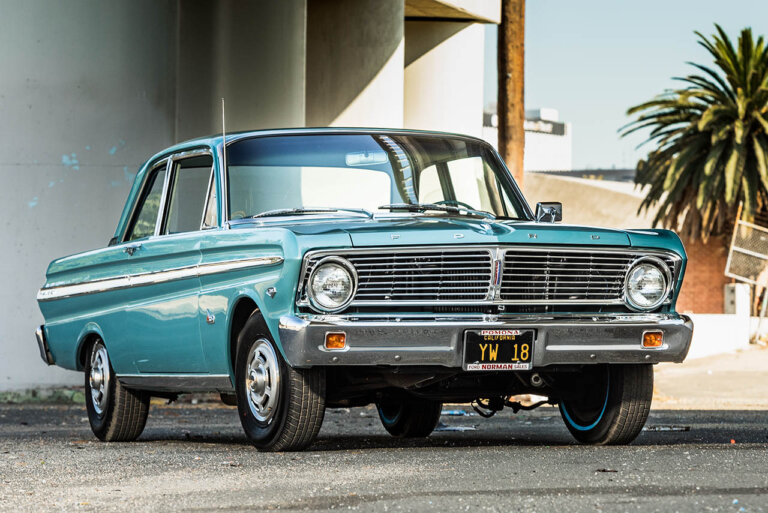 blue 75 ford falcon underneath bridge