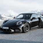 black BRABUS 911 Turbo S on road with ice mountains in background