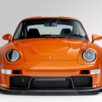 orange 911 on white background