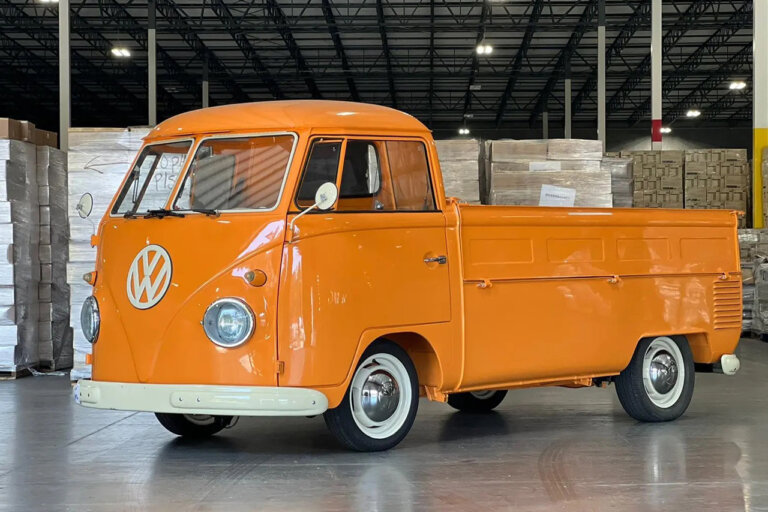 orange single cab transporter in garage