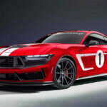 red ford mustang Dark Horse on dark background and white floor