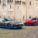 grey and red cars parked on brick road