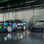 Two Skylines with HKS liveries in a concrete garage