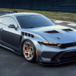 grey Mustang parked on racetrack
