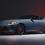 grayish blue Nissan Nismo Z car on dark background