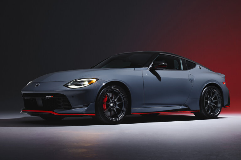 grayish blue Nissan Nismo Z car on dark background