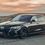 dark grey Brabus 850 on brick road with sunset in background