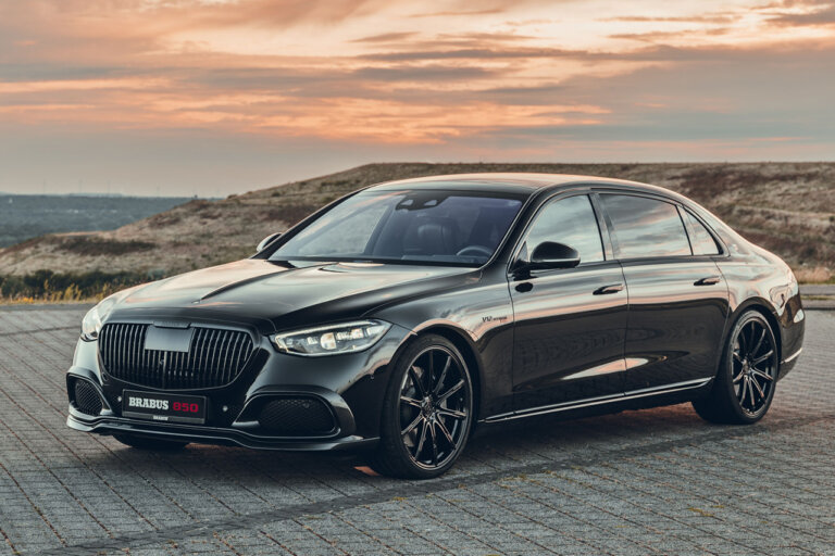 dark grey Brabus 850 on brick road with sunset in background