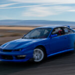 Blue Kouki S14 drifting through a turn
