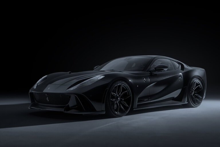 Black Novitec N-Largo S parked in a dark room with one light pointed toward the rear of the car