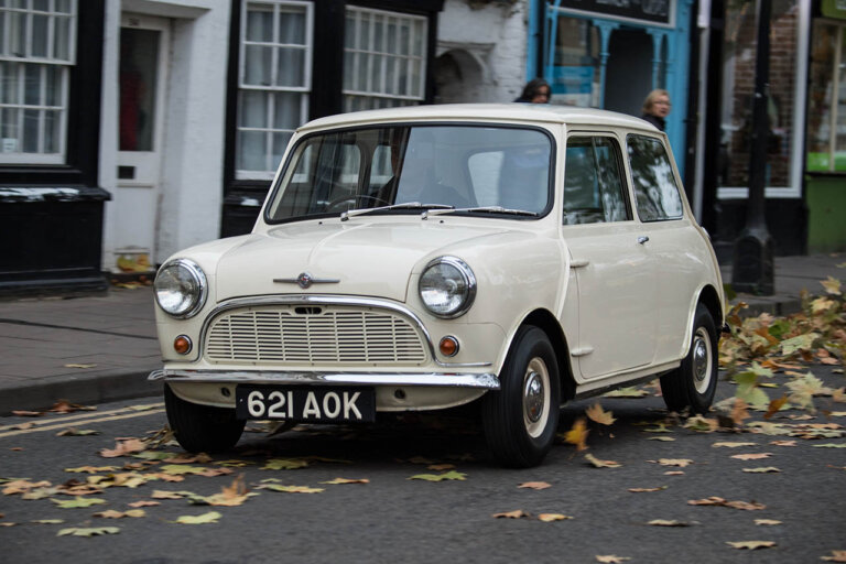 white morris mini minor on a city street