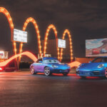 blue porsche 911 in front of mcdonalds sign