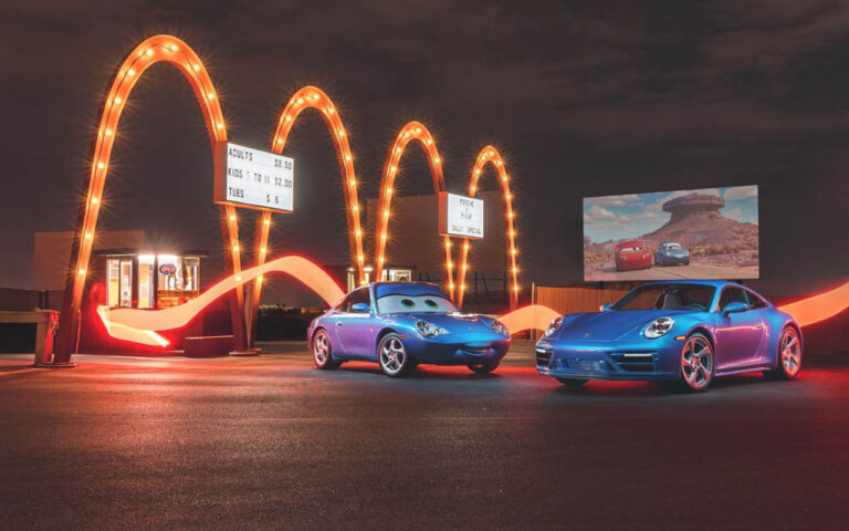 blue porsche 911 in front of mcdonalds sign