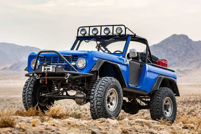 1966 blue bronco on desert rocks