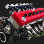 L-Engine close up with Nismo DOHC upgrade, engine is displayed with black background