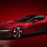 red Ferrari 12Cilindri sports coupe parked in a room with a red background