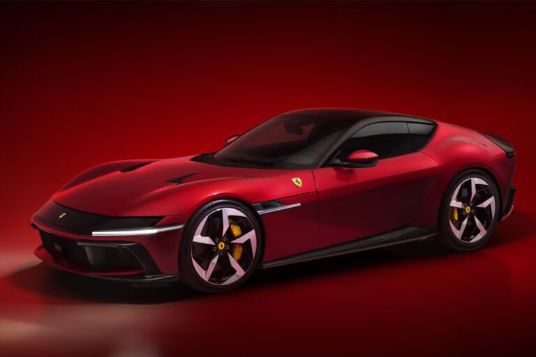 red Ferrari 12Cilindri sports coupe parked in a room with a red background