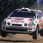 White Celica GT-Four flying through the air