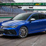 Blue VW Golf R parked at an angle on a racetrack