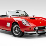 Red Ferrari 250 GT California replica car pictured in an all white room