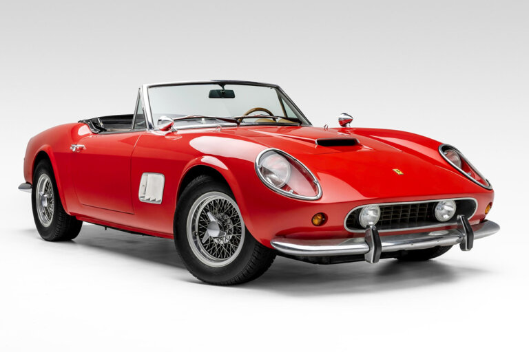 Red Ferrari 250 GT California replica car pictured in an all white room