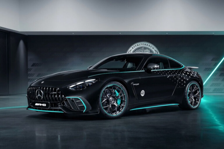 Black and blue accent Mercedes-AMG GT 63 Pro car in a room with a white logo behind the car on a wall with a blue lazer light near the car