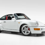 White 911 Turbo S parked in a white room