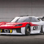 White and red Porsche Mission R parked at an angle in front of a white brick wall with the number 01 on the door.