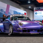 Purple Porsche RWB 993 911 at Shandong Stopart brake materials booth during the SEMA 2024 event.