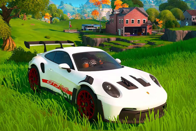 White Porsche 911 GT3 RS parked in the game Fortnite with grass landscape with barn in the background.
