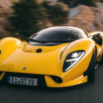 yellow de tomaso p72 racing on a mountain road