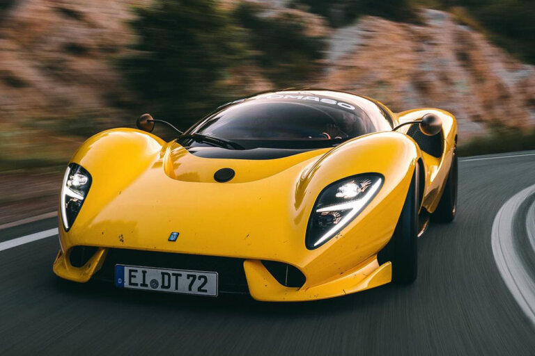 yellow de tomaso p72 racing on a mountain road